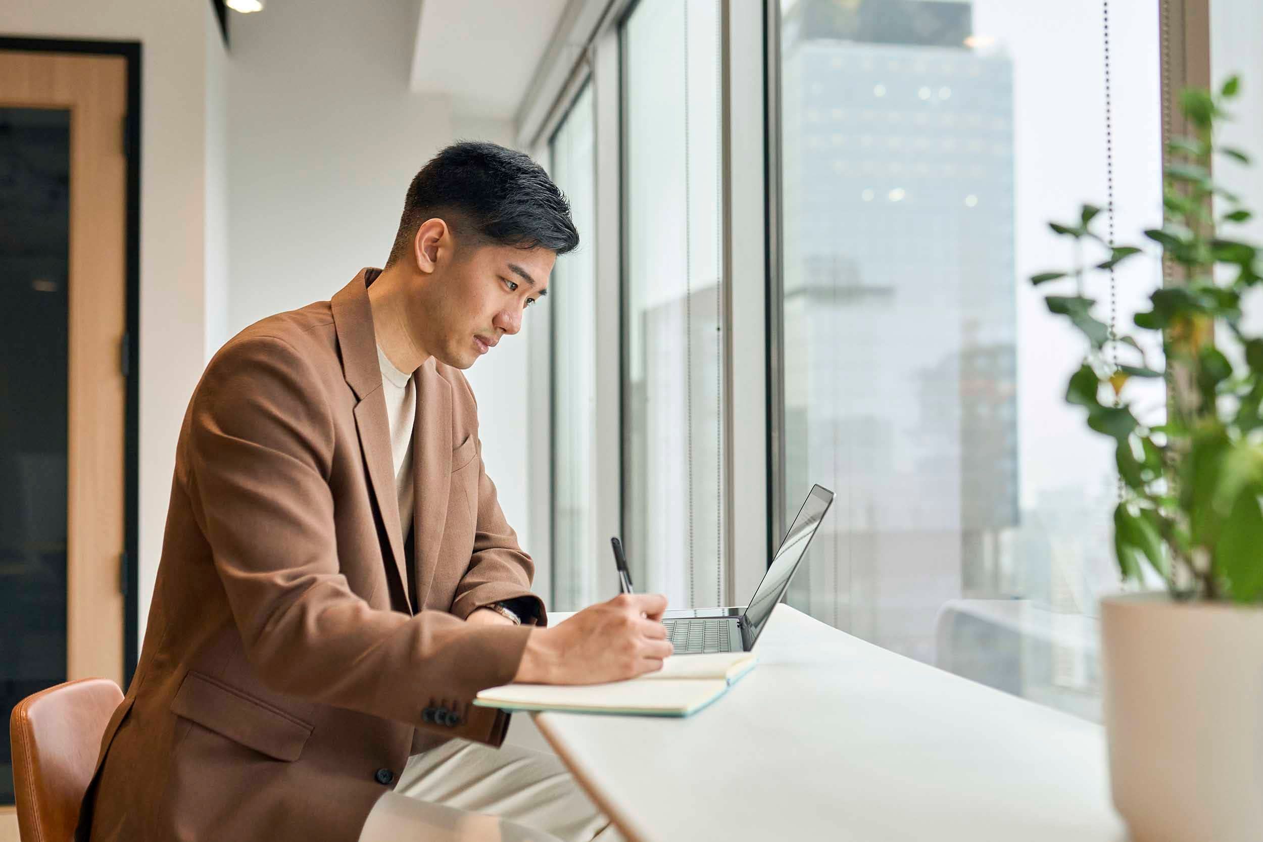 Man working by window