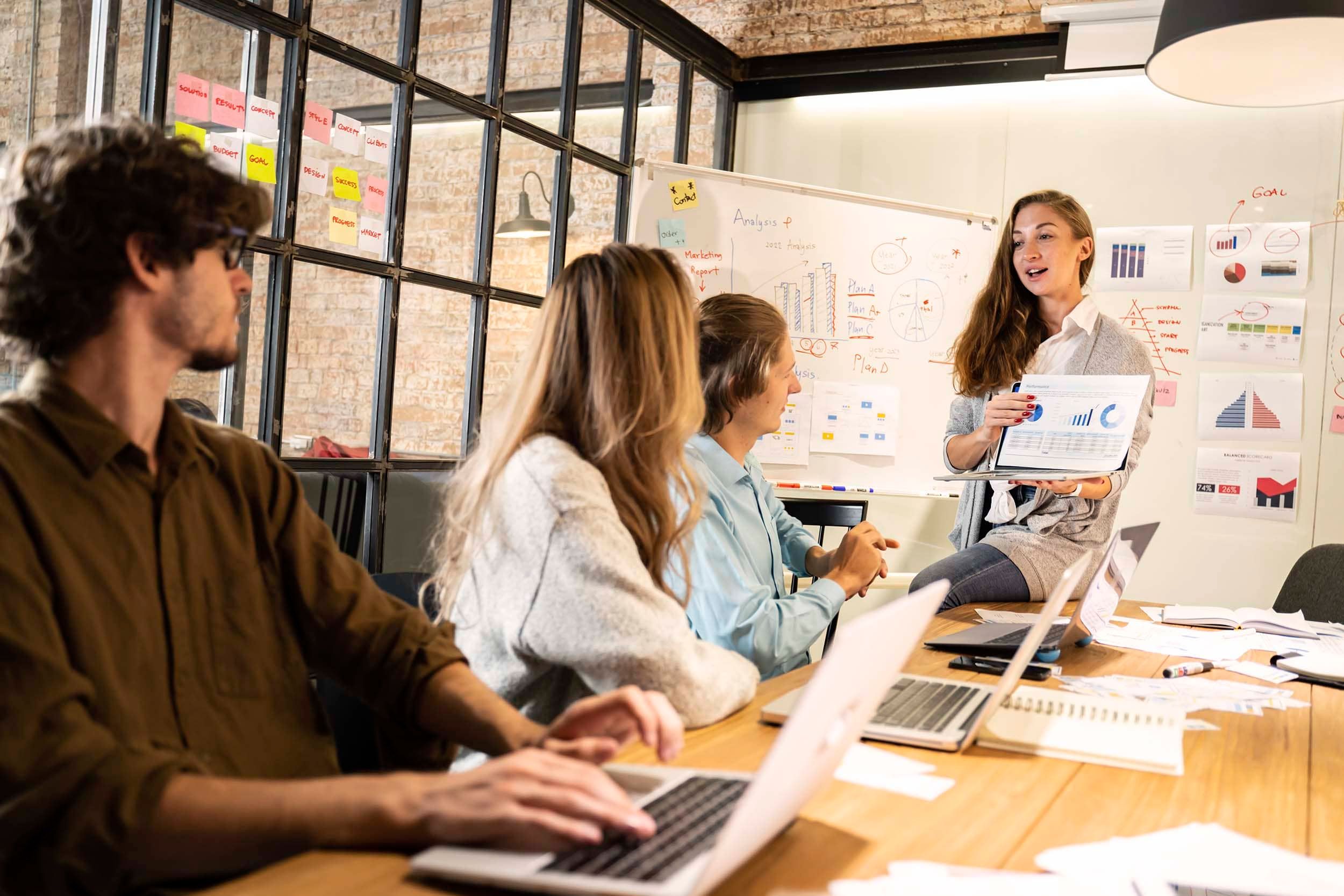 colleagues looking at papers