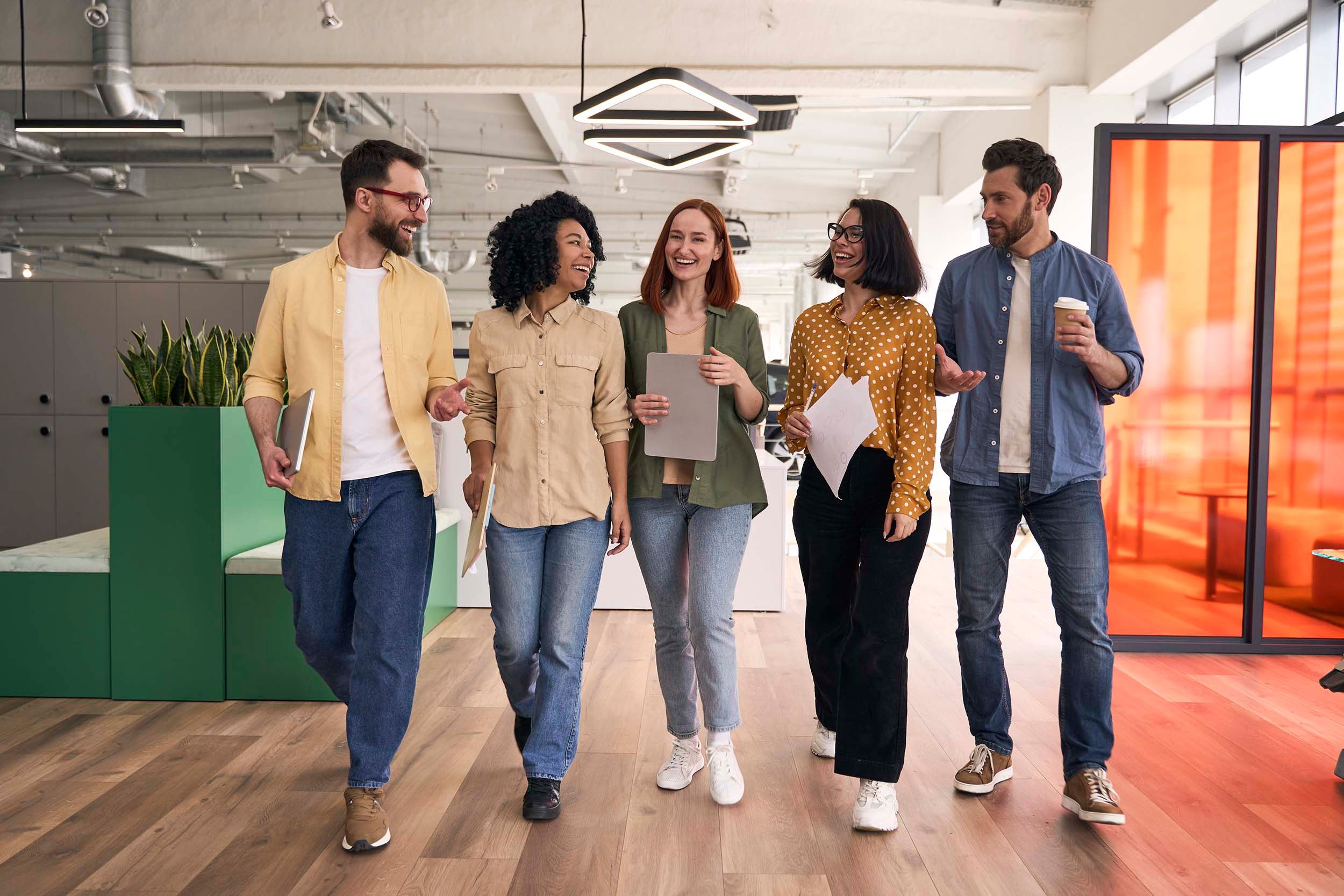 colleagues walking in colorful office