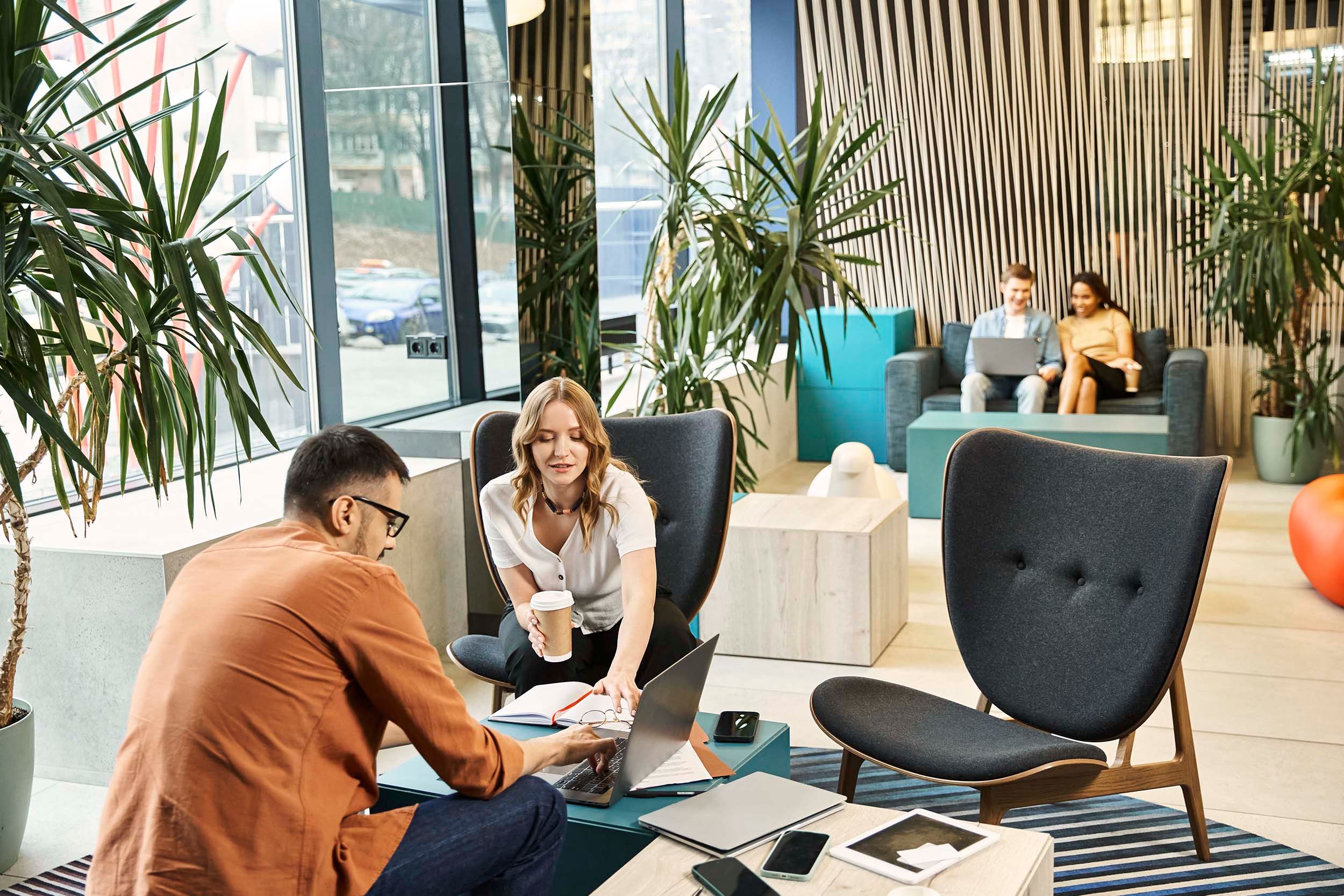 colleagues working in common area