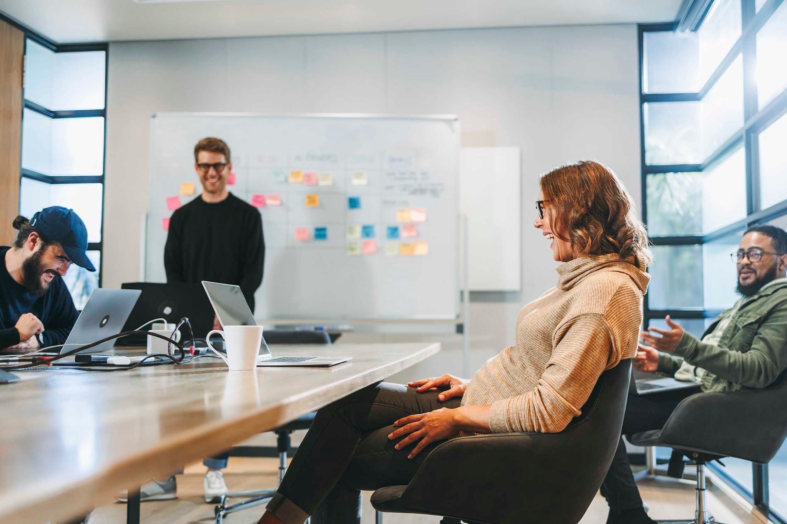 Four colleagues in a meeting