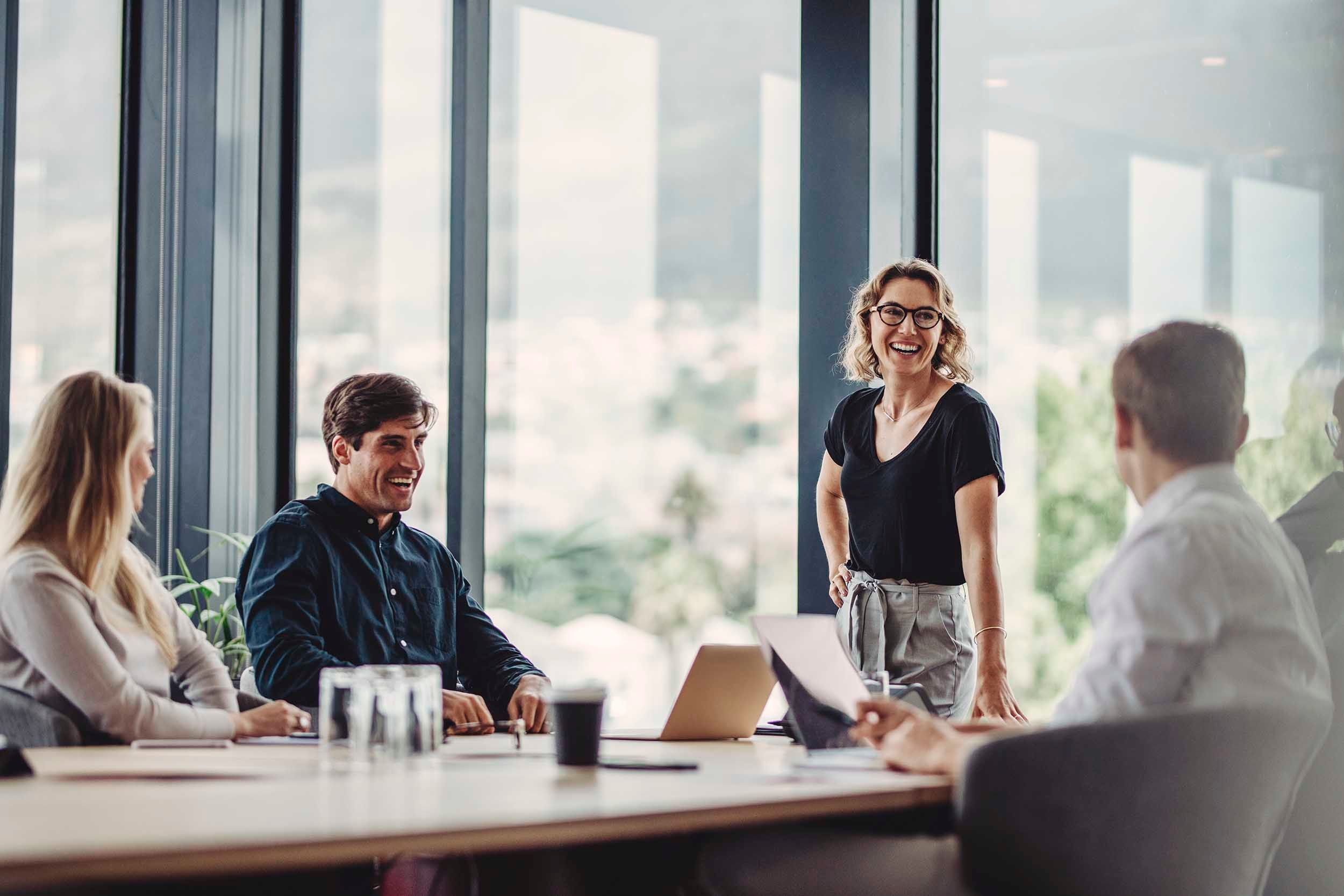 joyful meeting colleagues in a meeting room