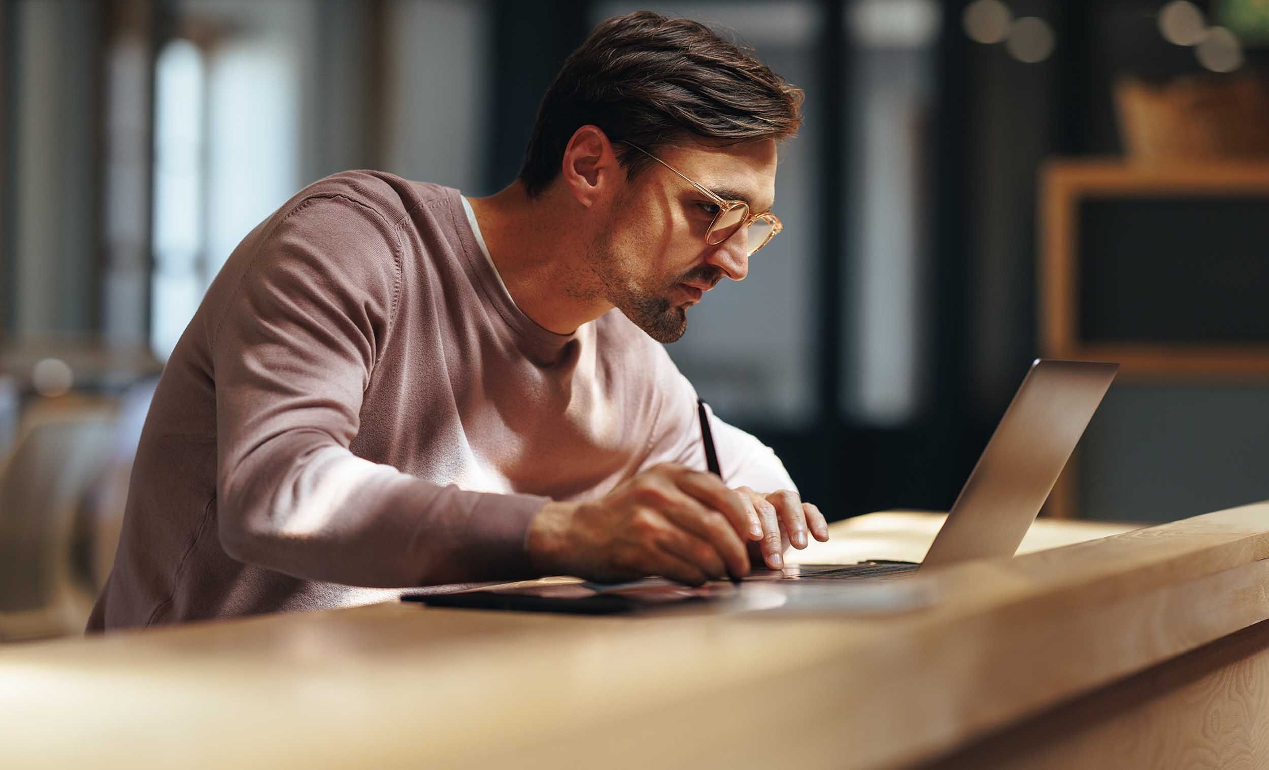 man working on trackpad