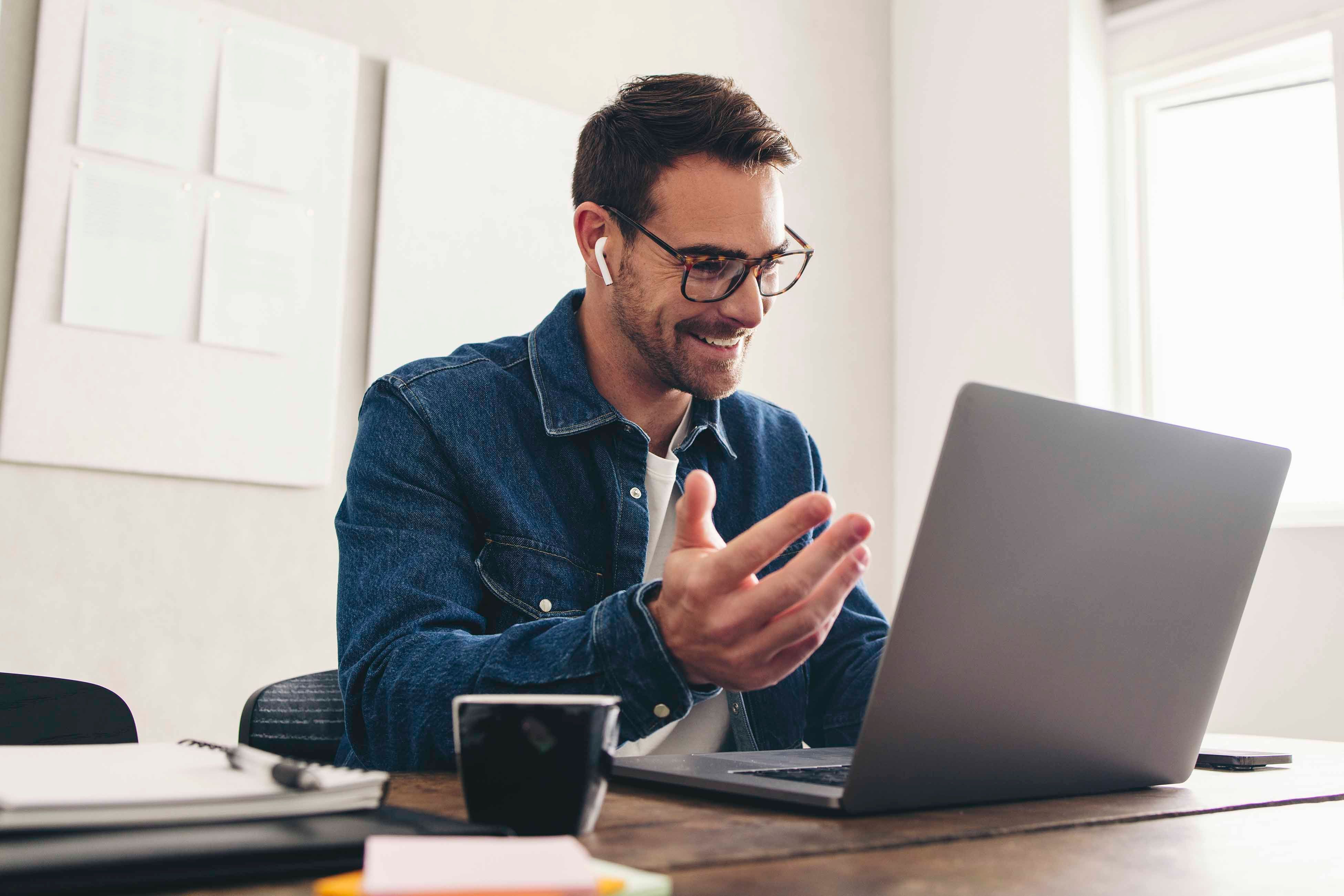 Man is having a online meeting in a Hybrid workplace - General