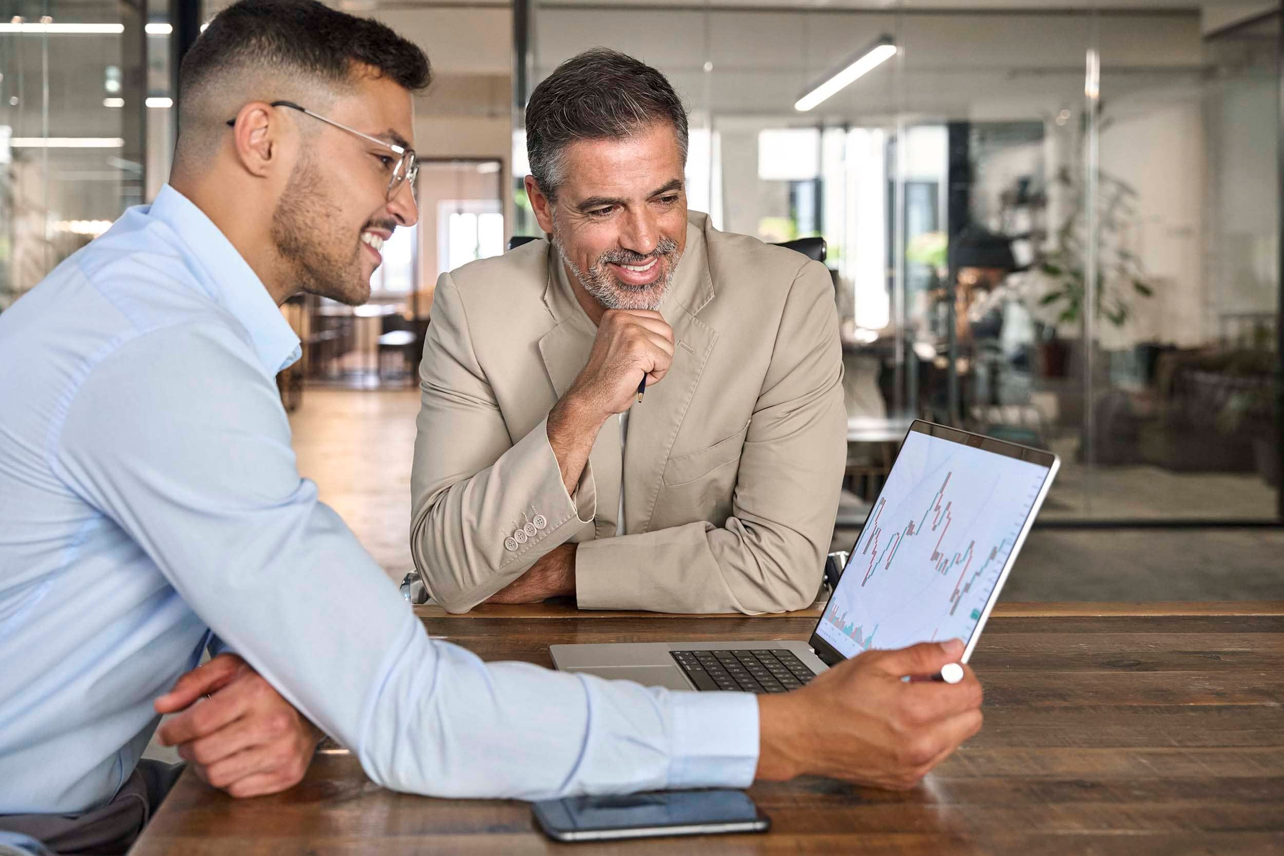 men looking at screen