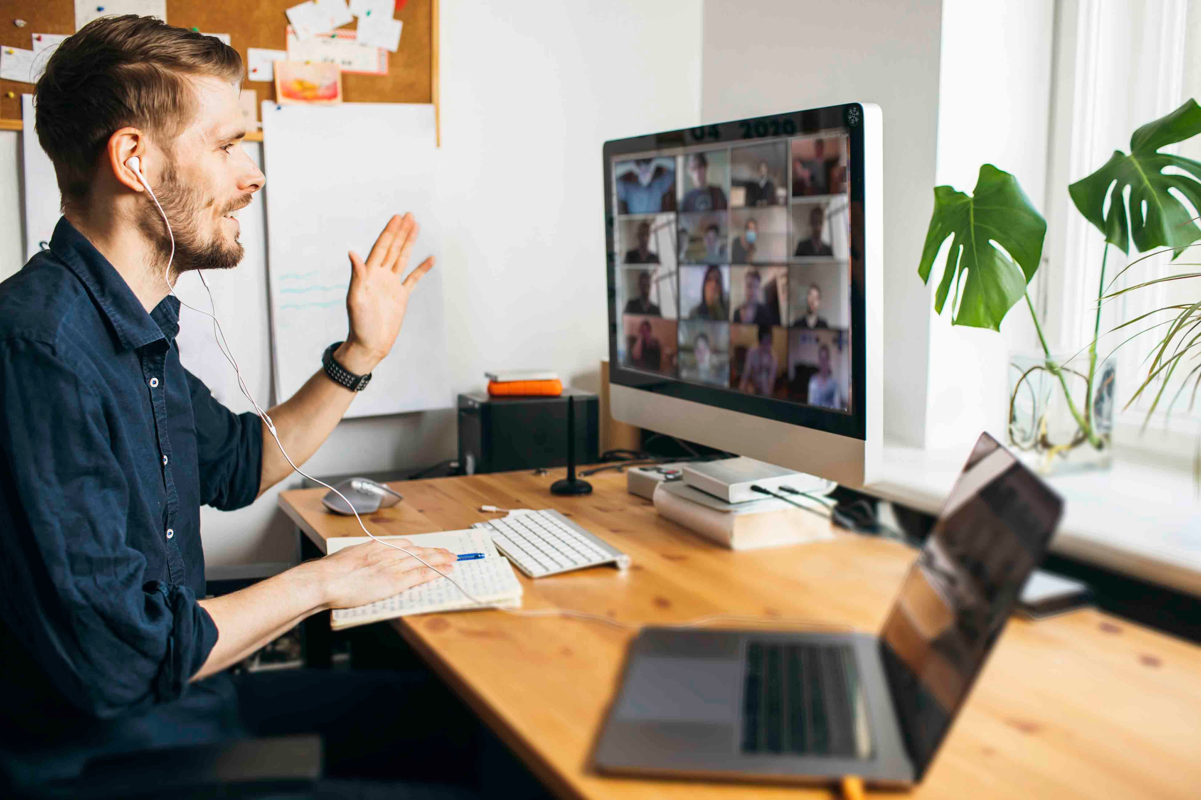 Man having an online meeting while working remote in a Hybrid workplace - General