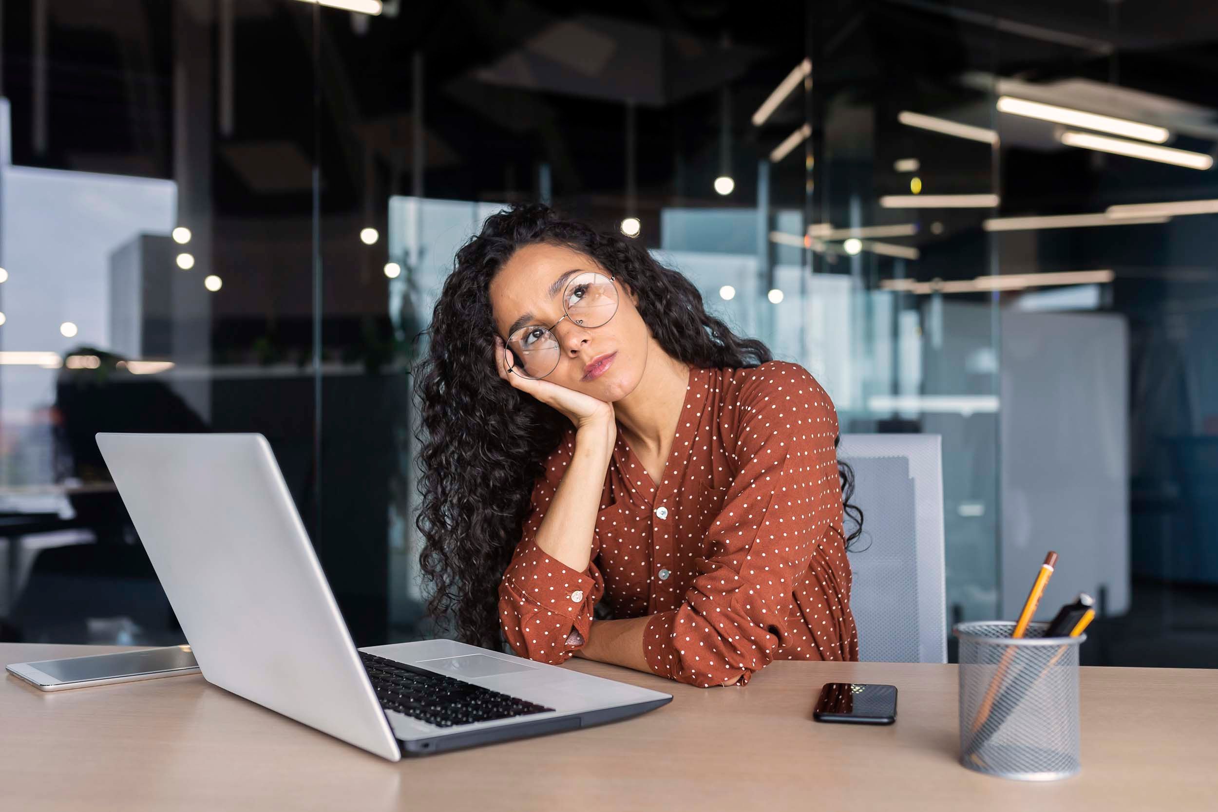 woman daydreaming at work