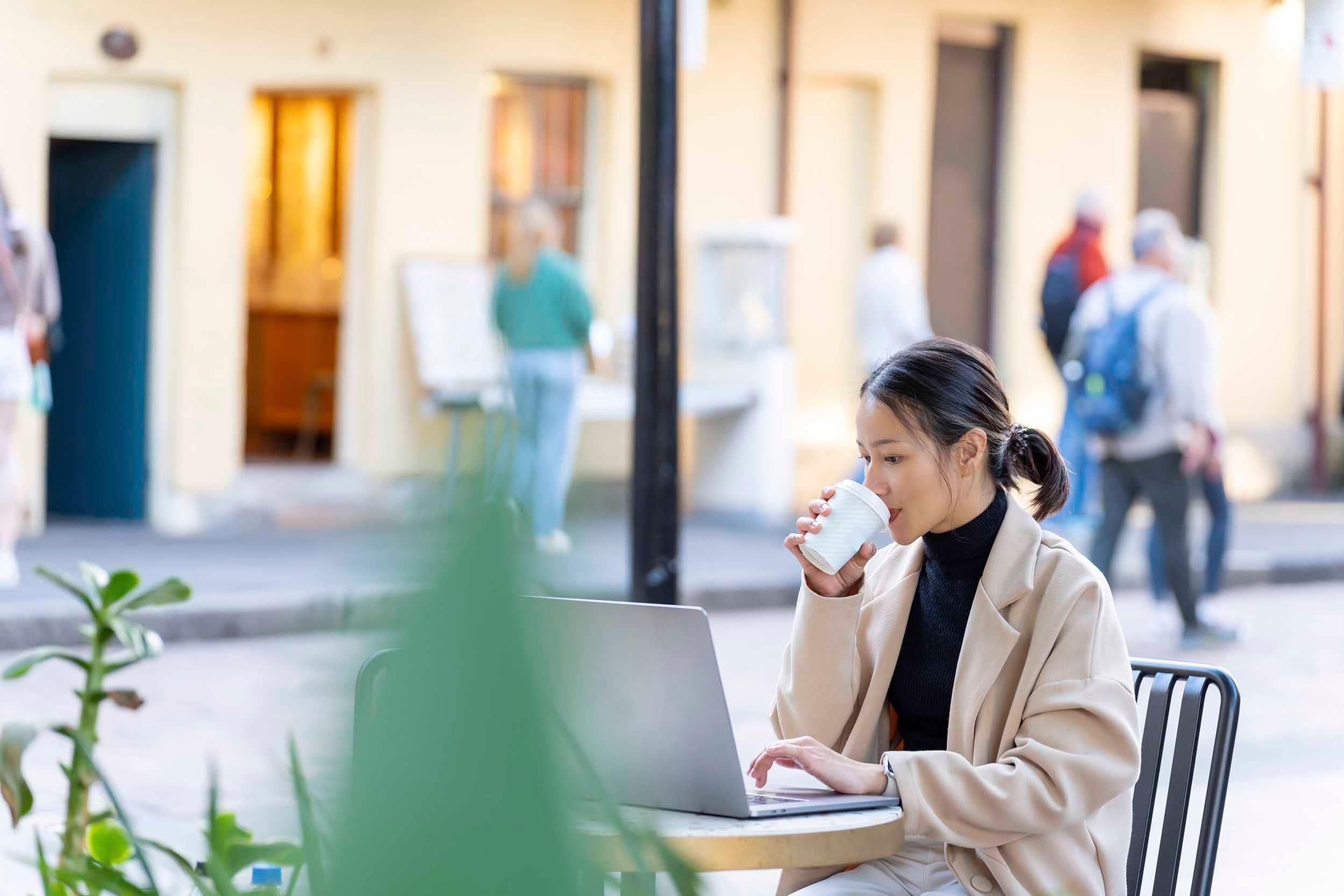 woman working and drinking coffee