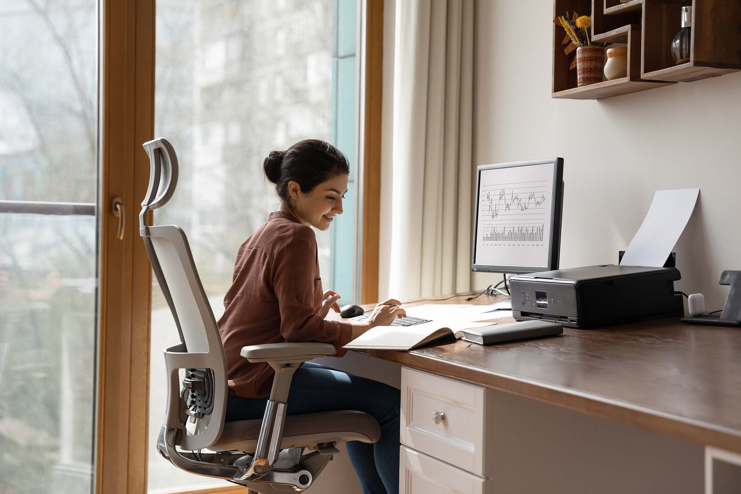 woman working at desk at home
