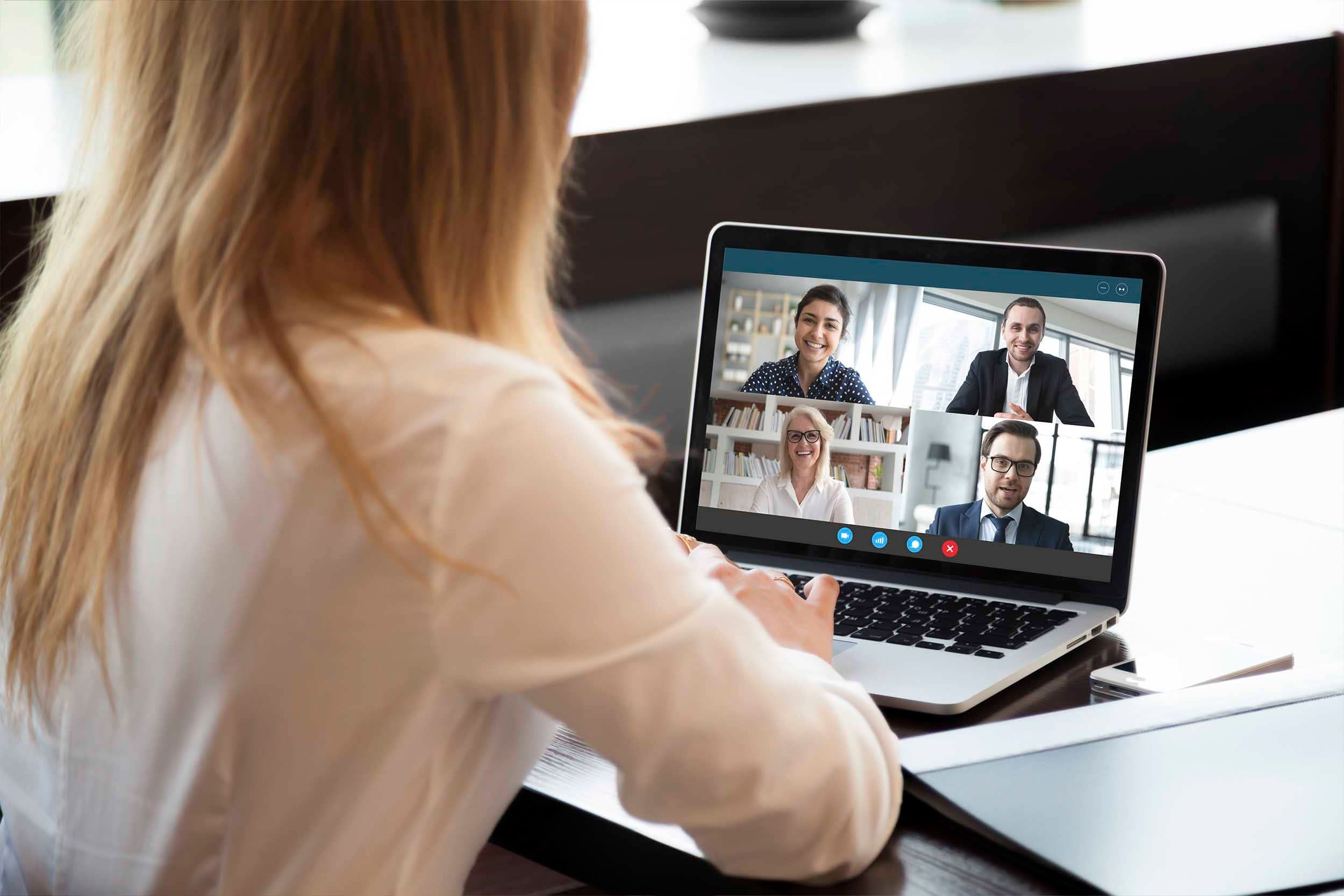 woman working on computer in a meeting